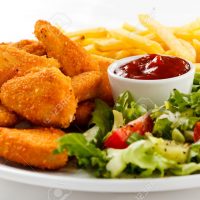 30653835-fried-chicken-nuggets-with-french-fries-and-vegetables